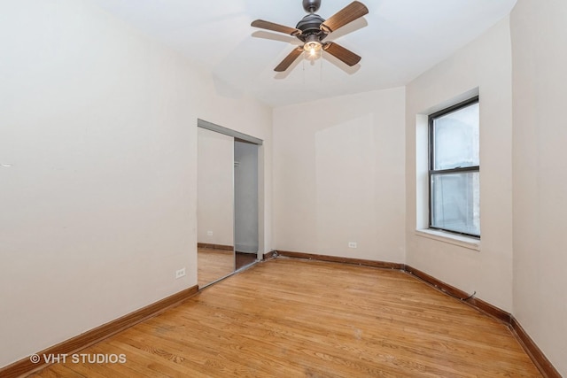 empty room with light hardwood / wood-style floors and ceiling fan