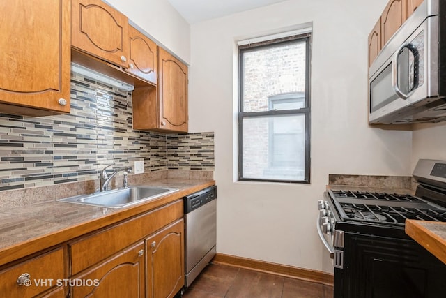 kitchen featuring backsplash, sink, and stainless steel appliances