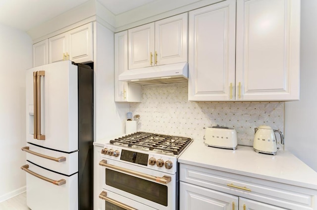 kitchen featuring white cabinets, decorative backsplash, and high end appliances