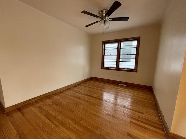 unfurnished room featuring light hardwood / wood-style flooring and ceiling fan