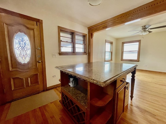 entryway featuring light hardwood / wood-style floors and ceiling fan