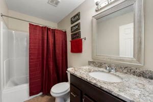 full bathroom featuring vanity, toilet, and shower / bath combo with shower curtain