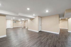 basement featuring dark hardwood / wood-style flooring