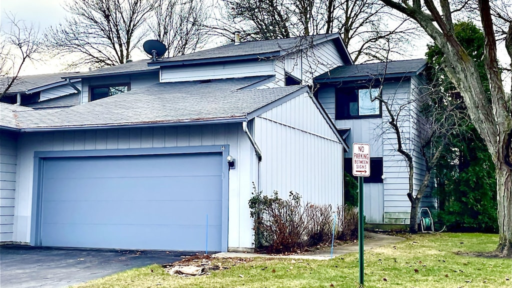 view of property exterior featuring a garage