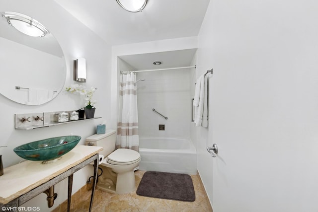 full bathroom featuring toilet, shower / tub combo with curtain, and sink