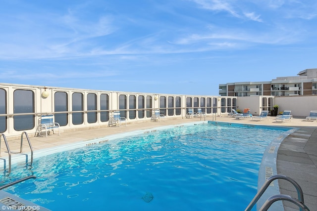 view of pool featuring a patio area