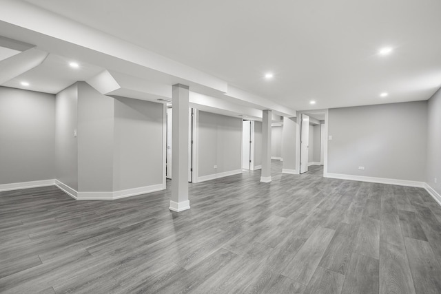 basement featuring hardwood / wood-style floors