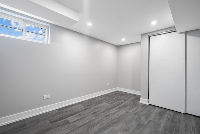 basement with dark wood-type flooring