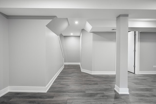 basement featuring dark hardwood / wood-style floors