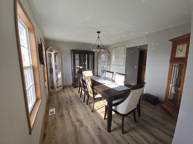 dining room featuring hardwood / wood-style floors and french doors