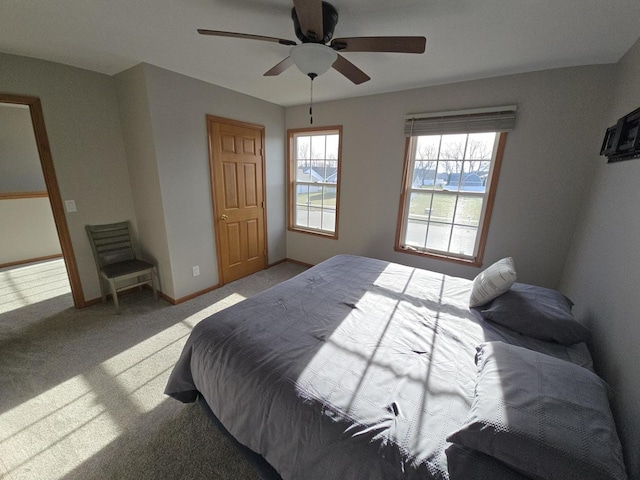 bedroom featuring ceiling fan and light colored carpet