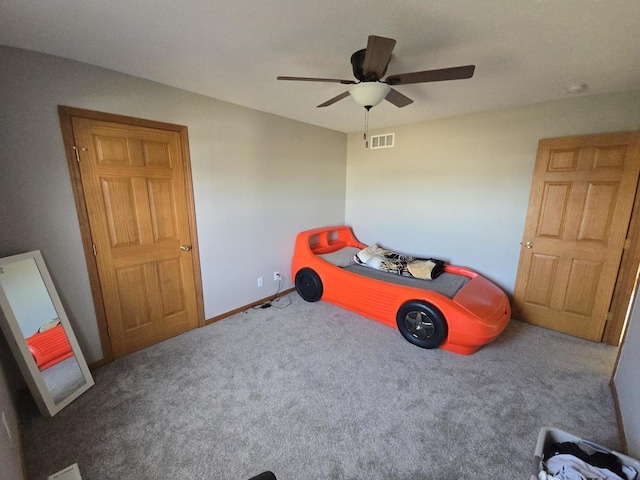 carpeted bedroom featuring ceiling fan