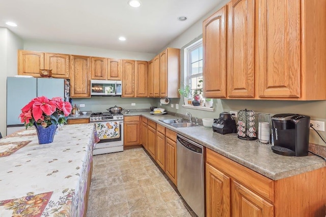 kitchen with sink and appliances with stainless steel finishes