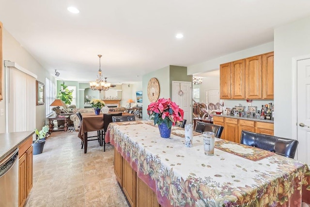 kitchen featuring dishwasher, a chandelier, and decorative light fixtures