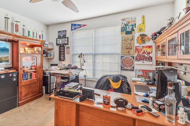 carpeted office with ceiling fan