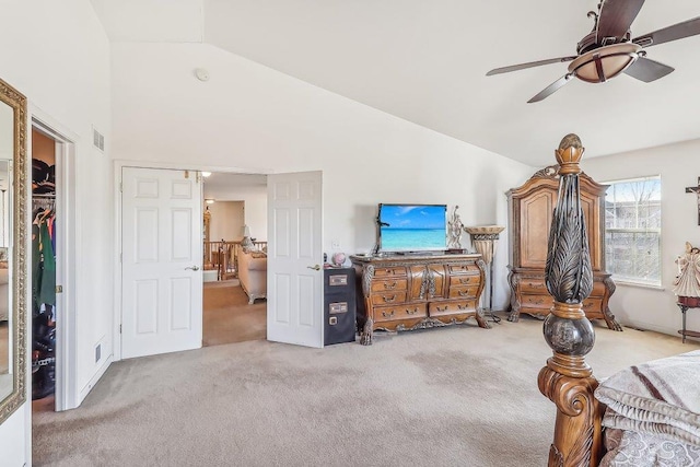 carpeted living room featuring ceiling fan and lofted ceiling