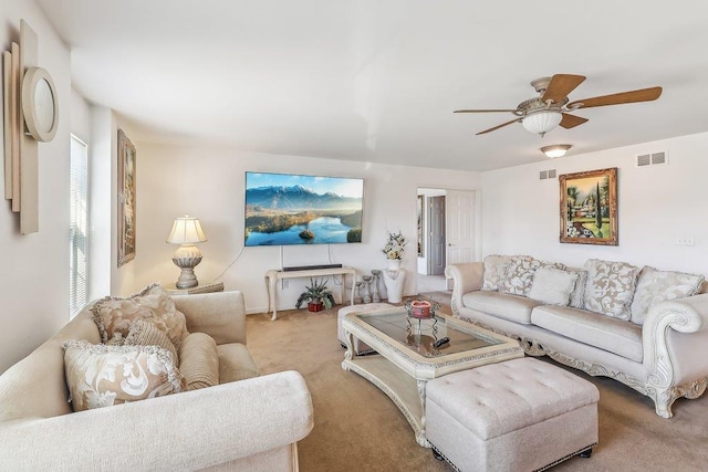 living room featuring light colored carpet and ceiling fan