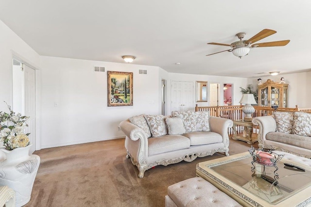 living room with carpet floors and ceiling fan