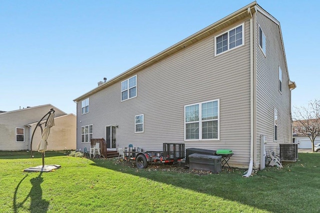 rear view of house with a lawn