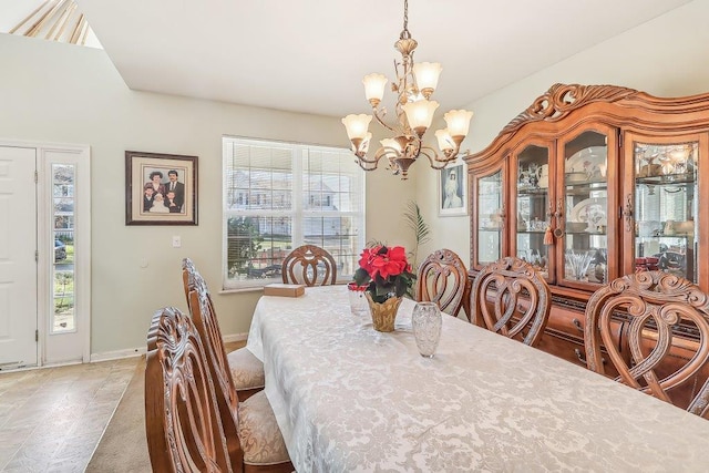 dining room with a notable chandelier and a healthy amount of sunlight