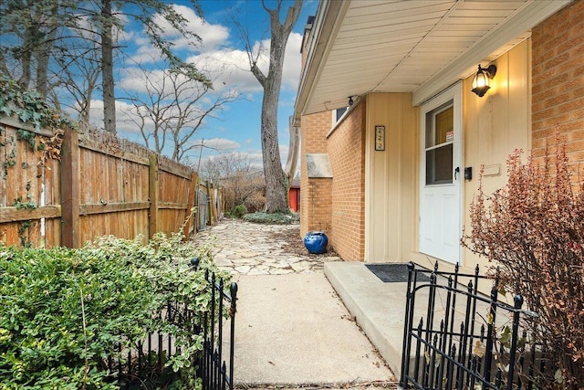 view of side of property with a patio area