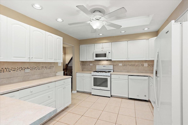 kitchen with ceiling fan, white cabinetry, white appliances, and light tile patterned floors