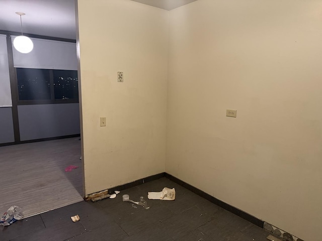 empty room with dark wood-type flooring