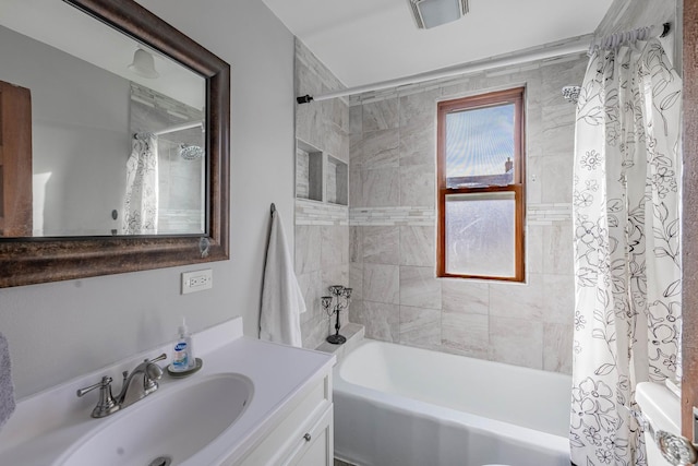 bathroom featuring shower / bath combination with curtain and vanity