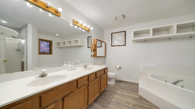 full bathroom featuring toilet, vanity, shower with separate bathtub, and hardwood / wood-style flooring