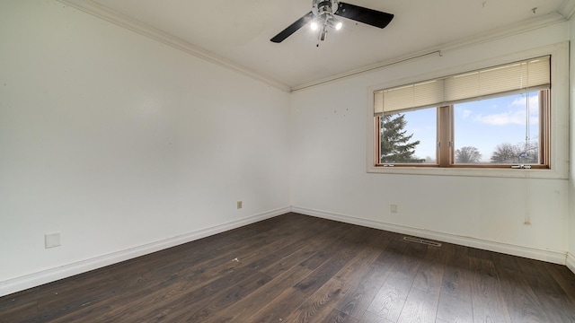 unfurnished room featuring ceiling fan, ornamental molding, and dark wood-type flooring