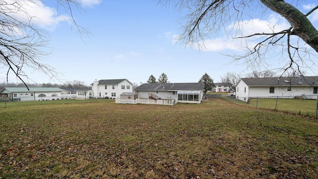 back of property featuring a lawn