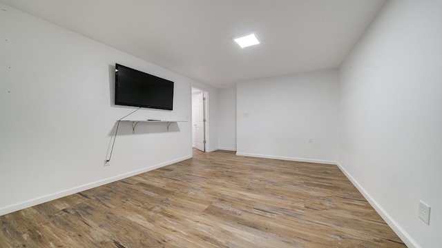 unfurnished living room with hardwood / wood-style flooring