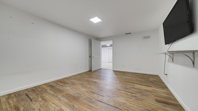 unfurnished room featuring hardwood / wood-style floors