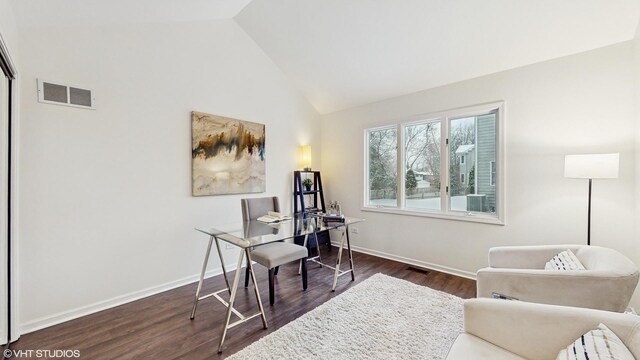 office area with high vaulted ceiling and dark hardwood / wood-style floors