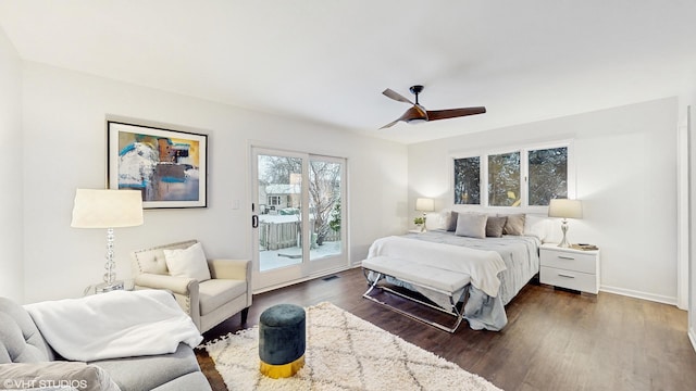 bedroom featuring access to outside, ceiling fan, and dark hardwood / wood-style floors