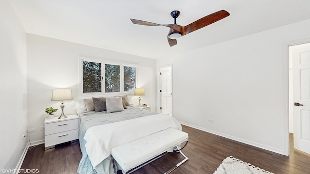 bedroom featuring ceiling fan and dark hardwood / wood-style floors