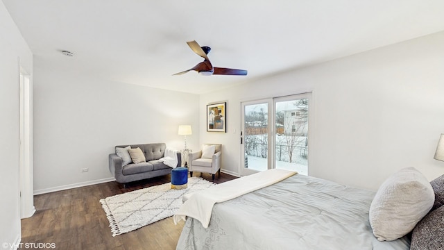 bedroom with access to outside, ceiling fan, and dark wood-type flooring