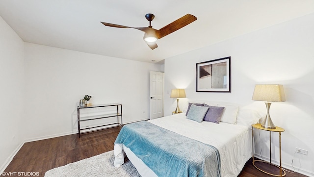 bedroom featuring dark hardwood / wood-style flooring and ceiling fan