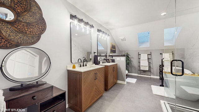 bathroom with vanity, lofted ceiling with skylight, and a shower with door