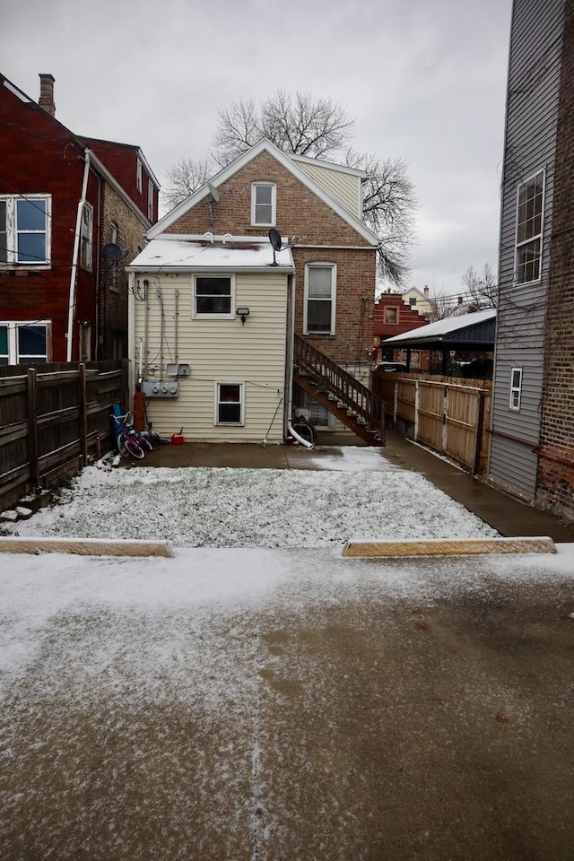 view of snow covered house