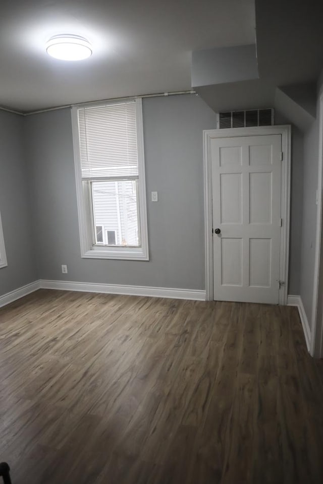 empty room featuring dark hardwood / wood-style floors