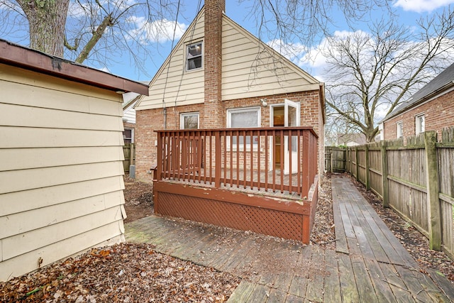 back of property featuring a deck