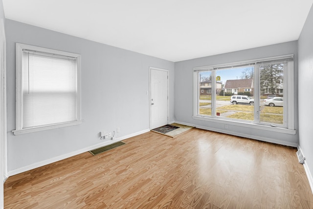 unfurnished room featuring light hardwood / wood-style flooring