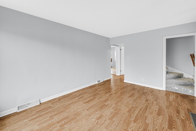 unfurnished room featuring light hardwood / wood-style floors