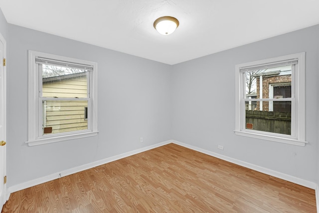 spare room featuring light hardwood / wood-style floors