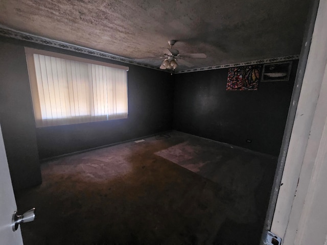 spare room featuring carpet flooring and ceiling fan