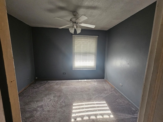 unfurnished room featuring carpet flooring, ceiling fan, and a textured ceiling