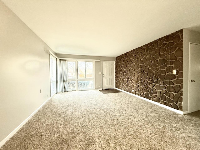 unfurnished living room with carpet flooring