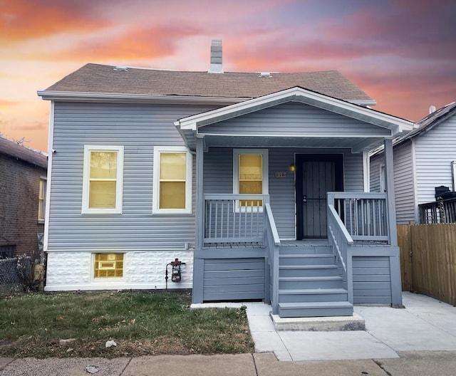 view of front of property featuring covered porch