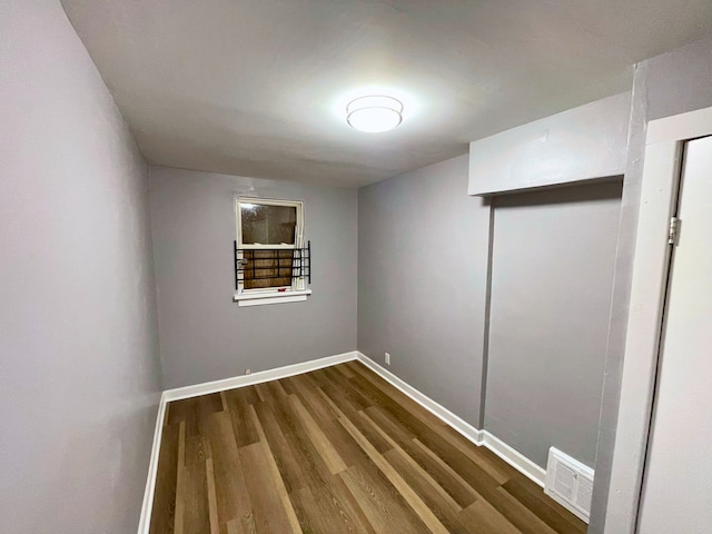 spare room with hardwood / wood-style floors